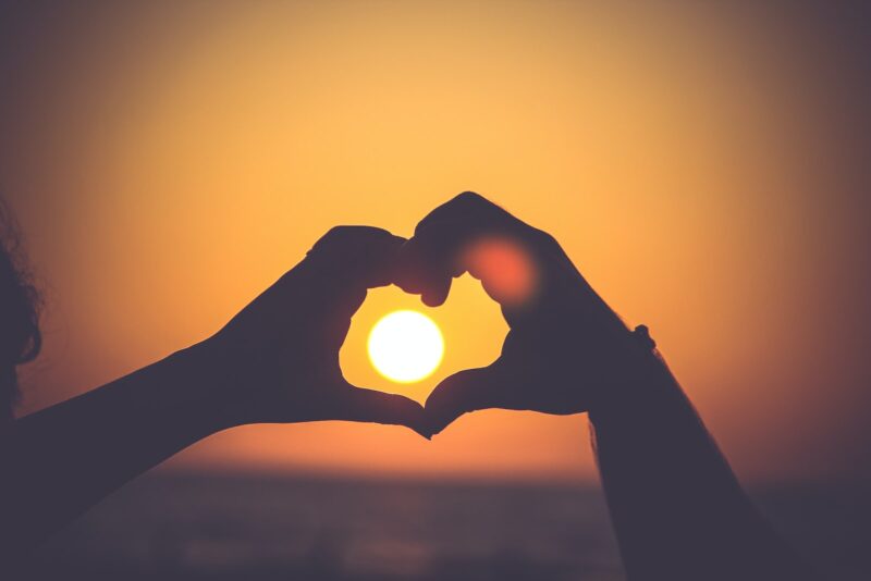 silhouette of person's hands forming heart.  Is there a hole in your heart?