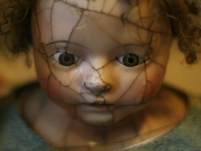 selective focus photography of porcelain doll