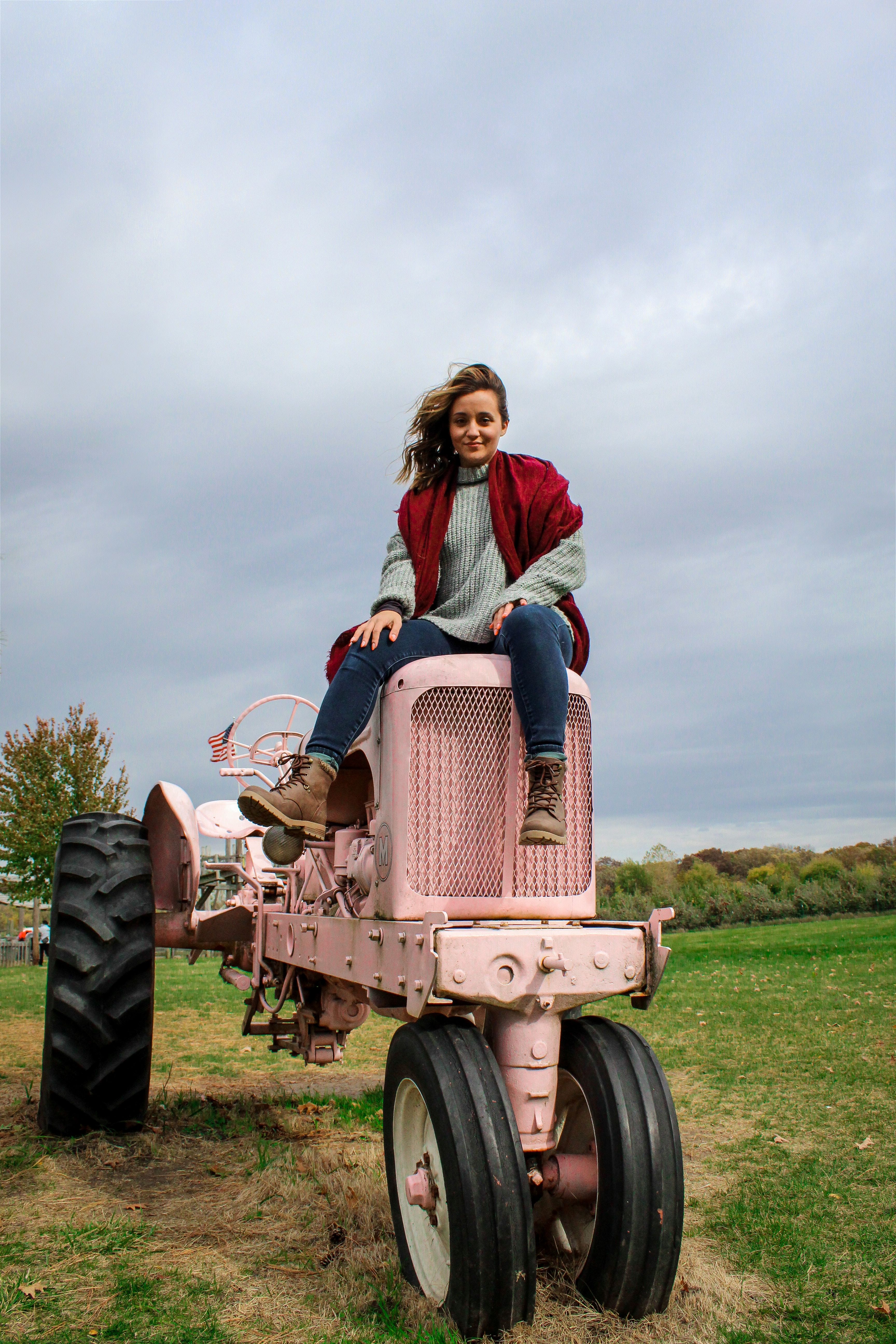 "All Mine" is probably what this girl is proudly saying about her pink tractor.