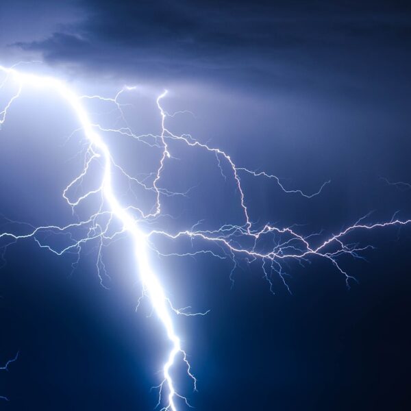 A power lightning strike during blue sky