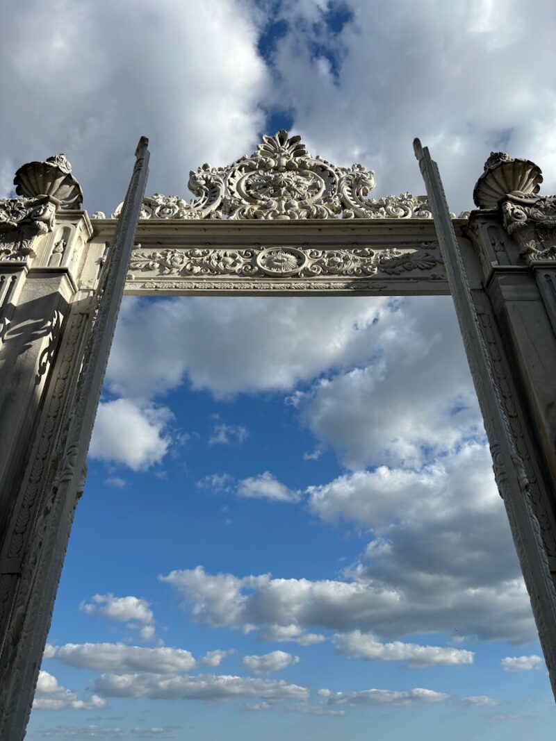 A large gate with a sky in the background